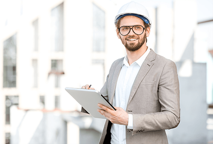 Man reviewing job details on computer using GoCanvas solutions