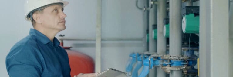 hvac worker on a mobile device